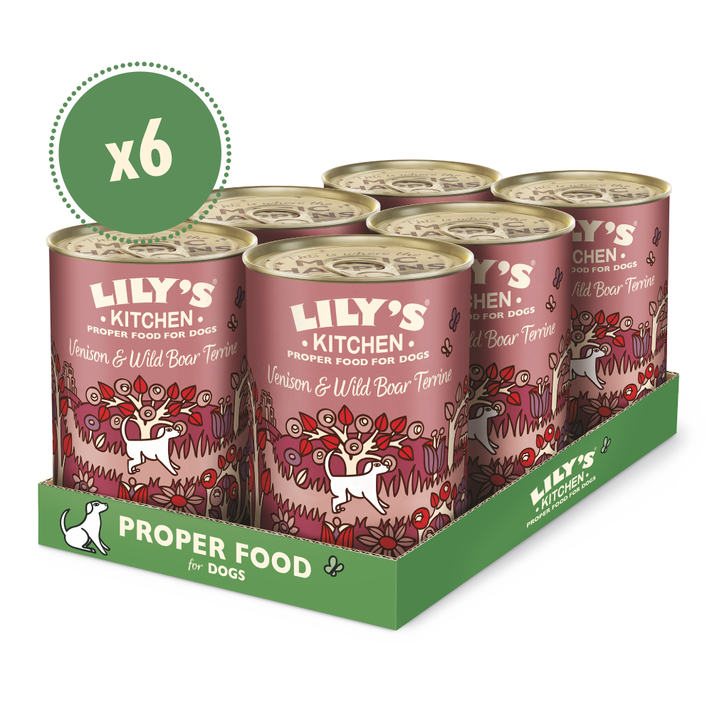 A pack of Lily's Kitchen dog food featuring venison and wild boar. The packaging is predominantly pink and green, with images of wild animals and plants.