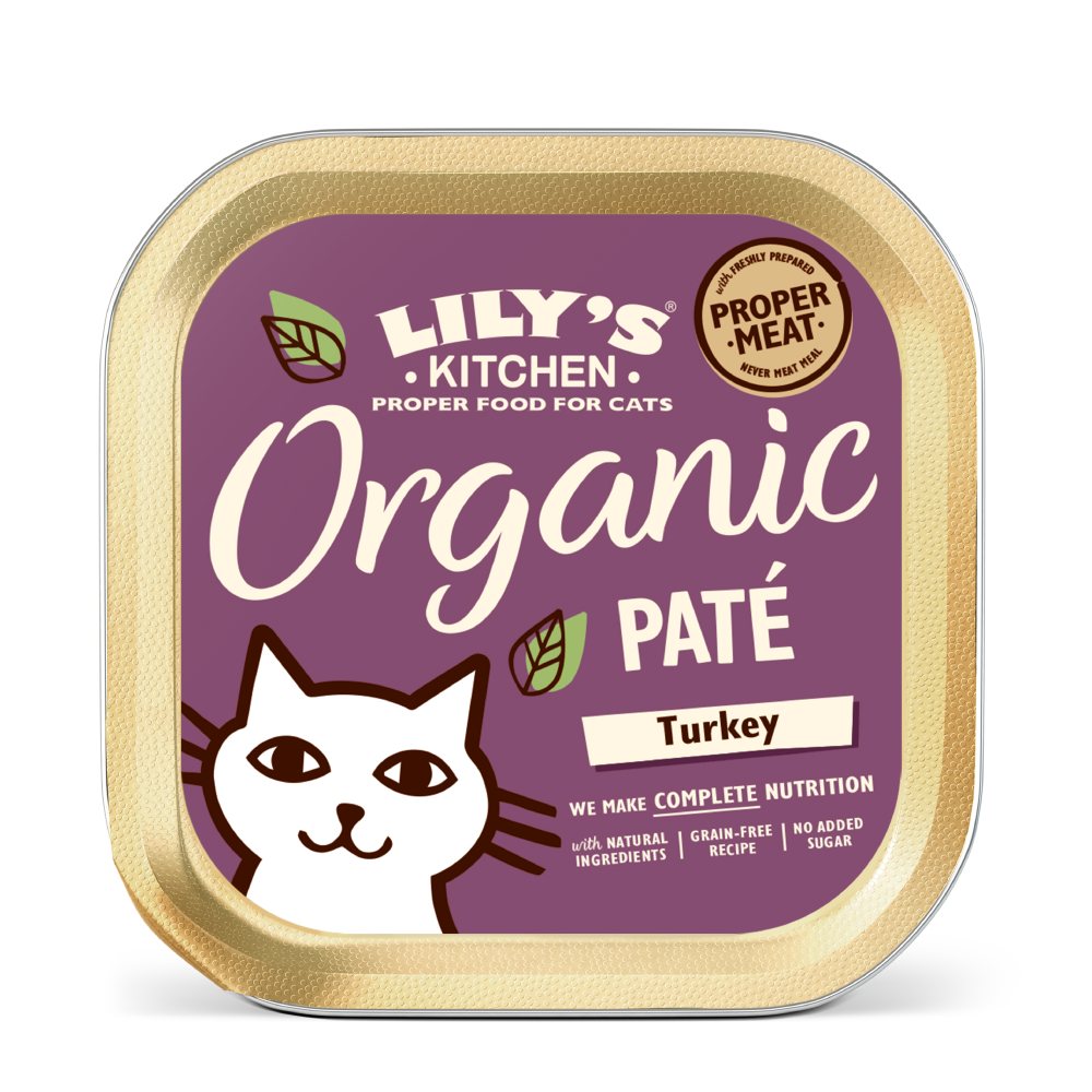 A tin container of Lily's Kitchen Organic Pâté with Turkey flavor for cats. The packaging is purple with a white cat illustration on the front.