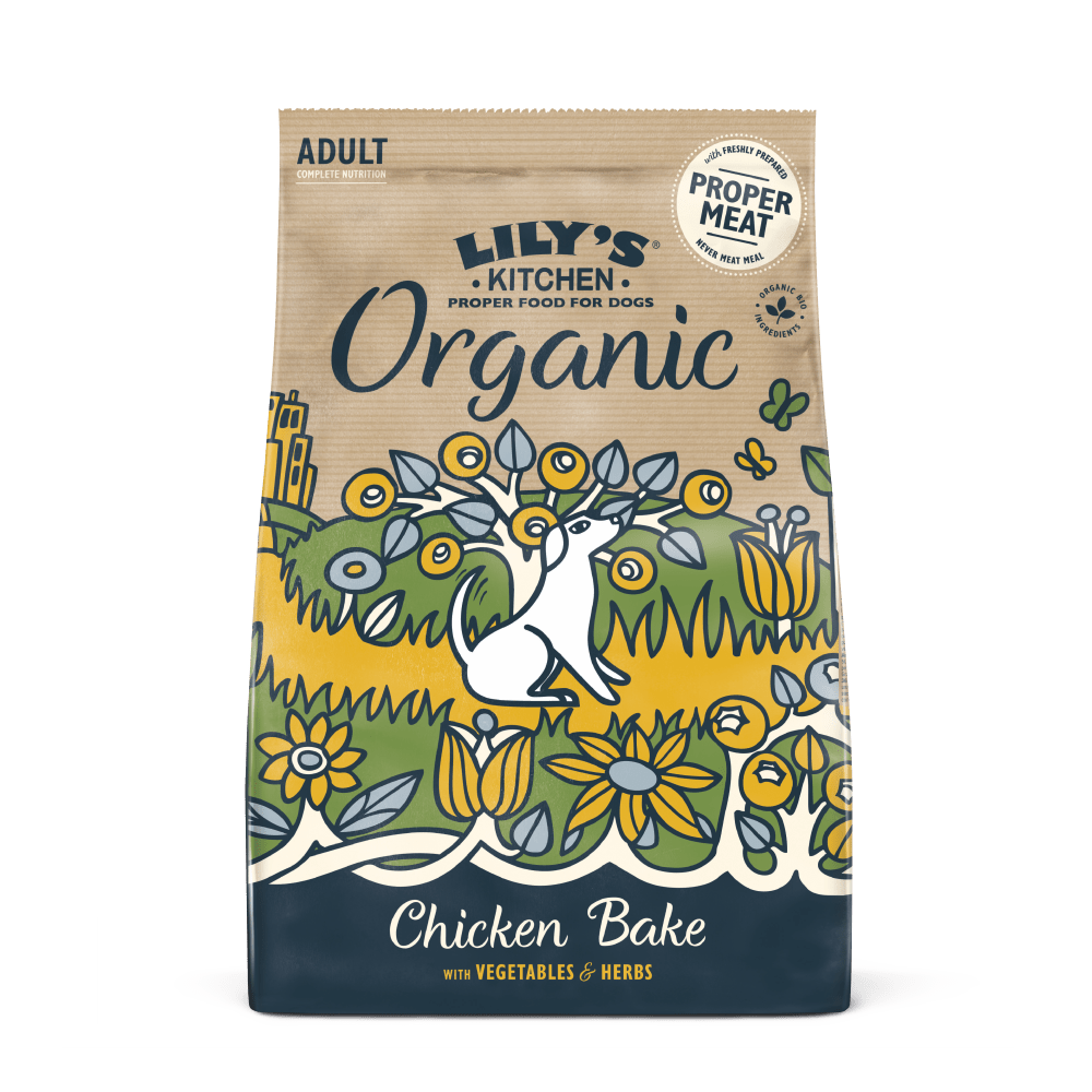 A bag of Lily's Kitchen Organic adult dry dog food with chicken, vegetables, and herbs. The packaging is colorful with an illustration of a white dog, flowers, and the text 'PROPER VEGETABLES & HERBS'.