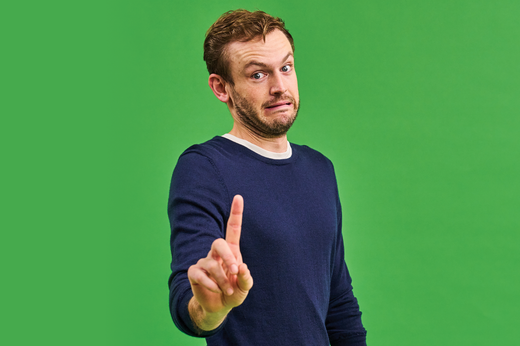 Rory the vet lifting his index finger