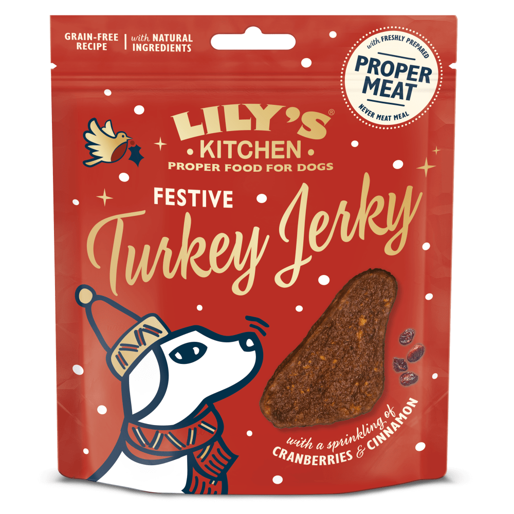 Red package of Lily's Kitchen Festive Turkey Jerky for dogs on a white background